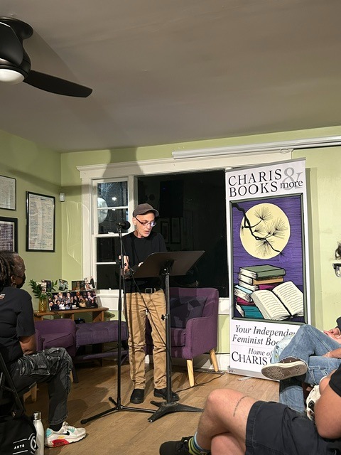 Samuel Ace reading an excerpt from Splendor at Charis's Open Mic